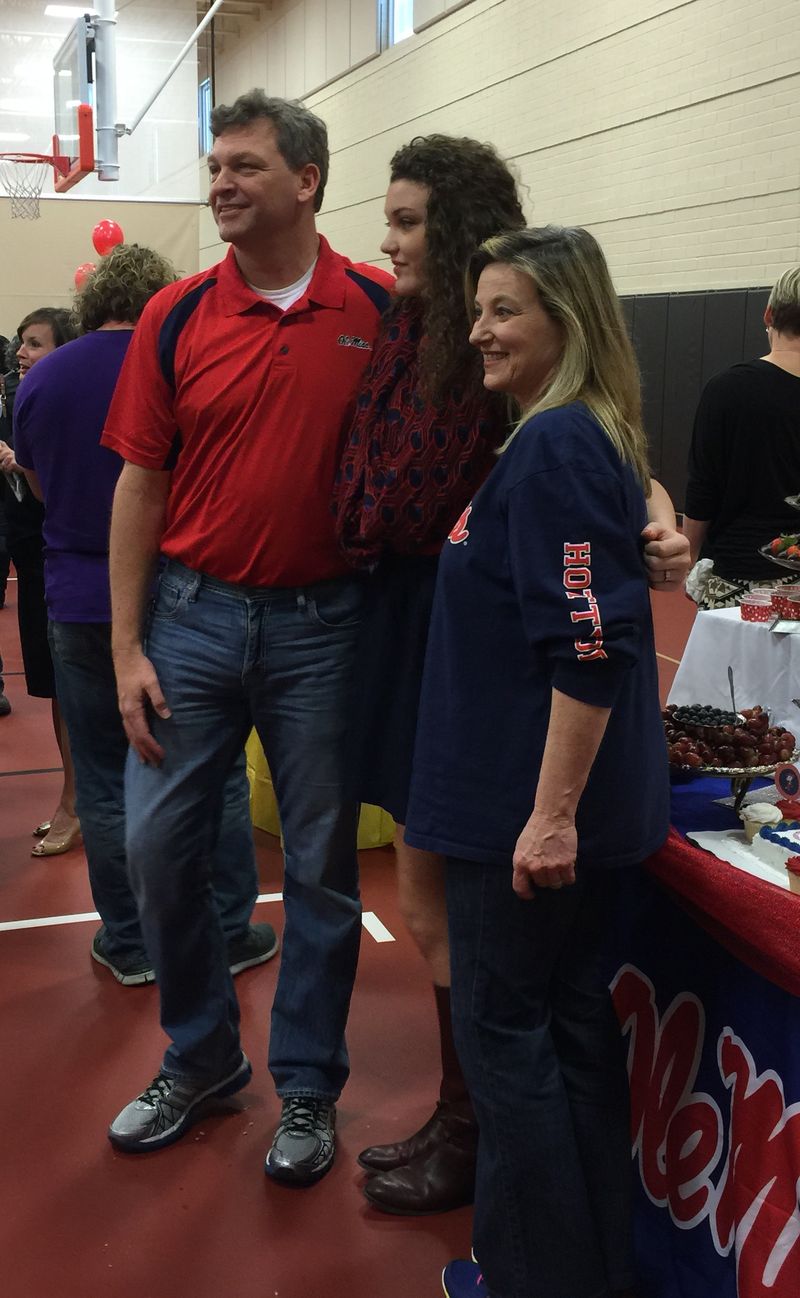 Family celebrating a college commitment